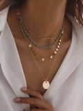 Gold-Tone Layered Necklace with Beads and Disc Pendant